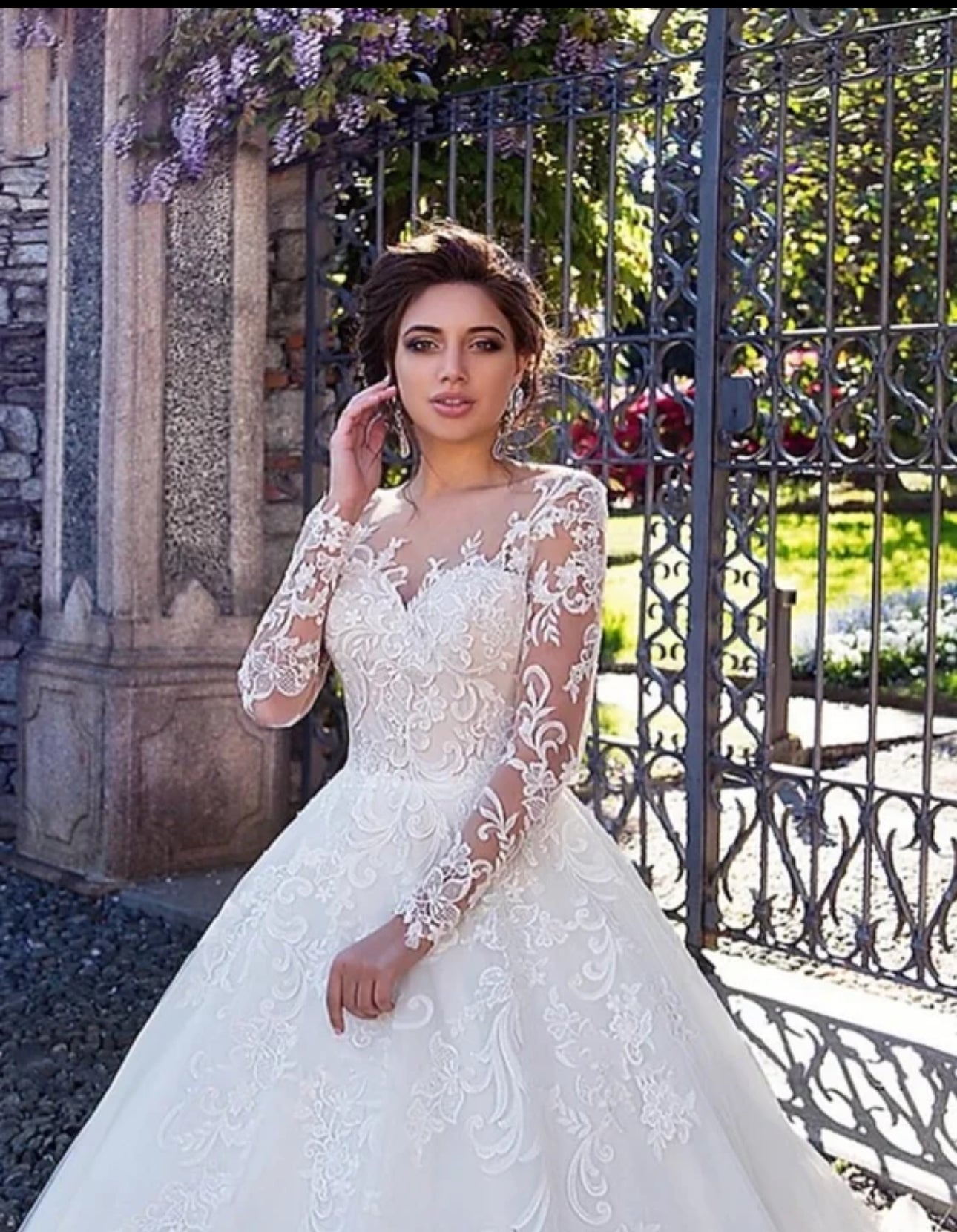 Experience Pure Elegance in our Long Sleeve Organza Bridal Ball Gown