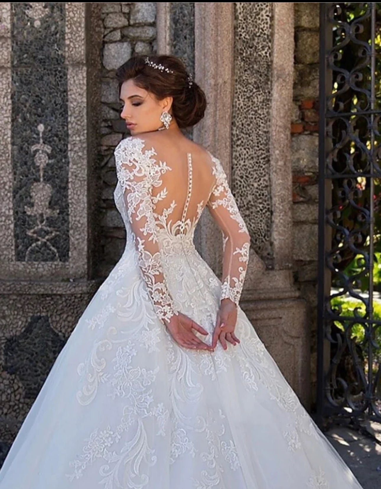 Experience Pure Elegance in our Long Sleeve Organza Bridal Ball Gown