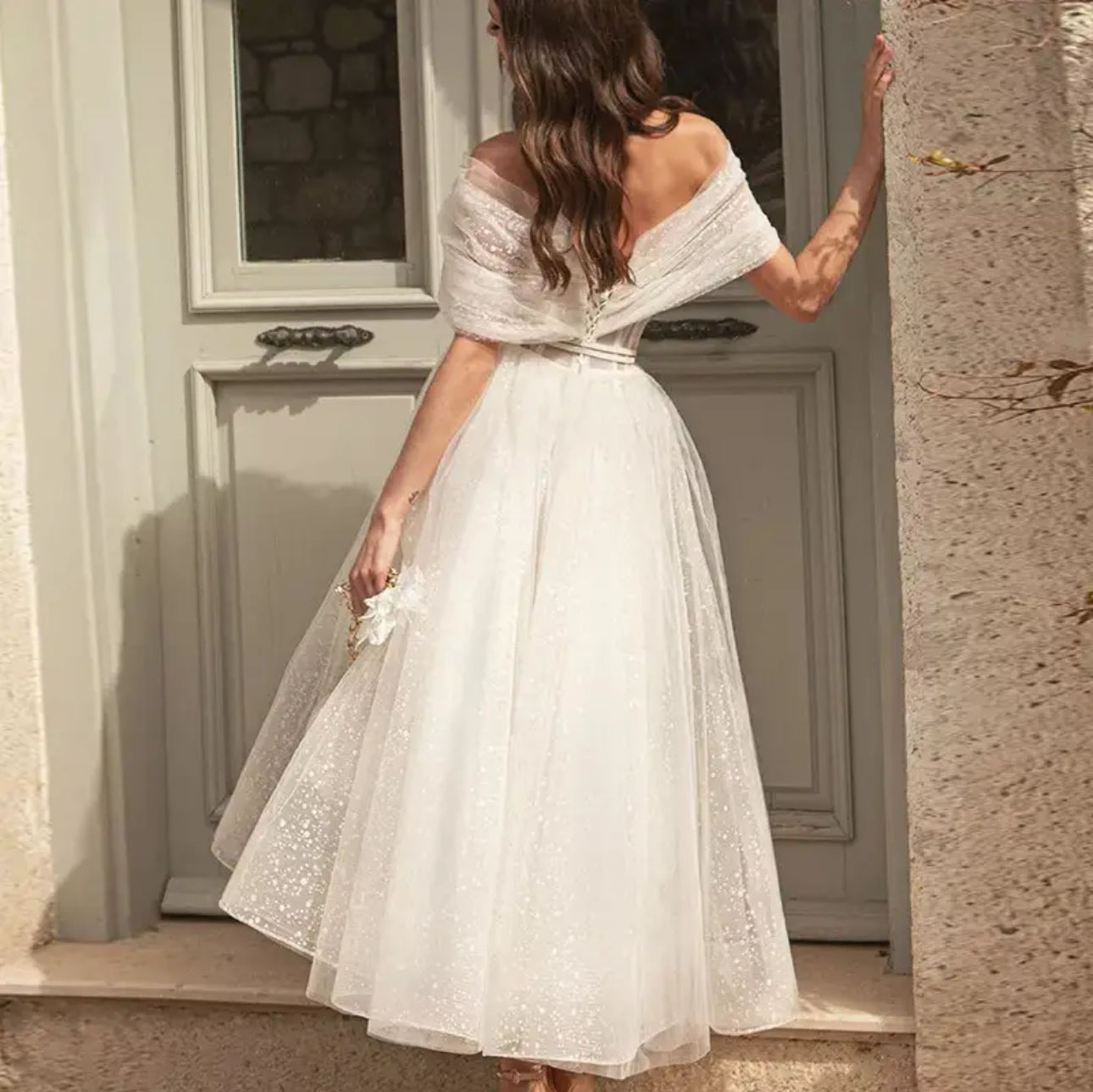 Sparkle on Your Big Day with our Tea Length Glittered Tulle Wedding Dress